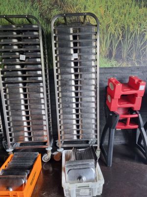 many trays of food sitting on the floor next to each other