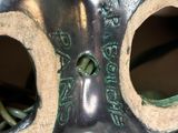 a metal mask with two holes in the middle of it