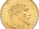 a close up of a gold coin with a man ' s face on it