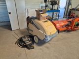 une machine posée sur le sol du garage