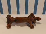 a small dog figurine sitting on a white table