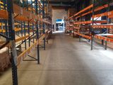 many shelves in the warehouse with boxes and boxes on them