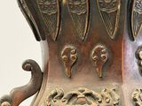a large bronze vase with an octopus on the top of it