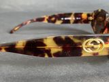 a pair of sunglasses with a gucci logo on them