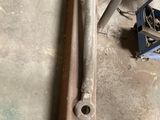 a piece of metal on the floor next to some tools
