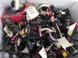 a box full of assorted cameras with tags on them