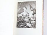 an open book with a drawing of a woman and a bird on it