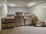 a room with a lot of boxes and boxes on the floor