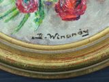 a painting of a bunch of flowers in a gold frame