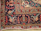 an image of a rug on a floor with a cat laying on it
