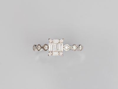 an emerald and diamond ring
