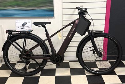 a black and white checkered floor with a bicycle on it