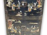 an image of a black cabinet with oriental scenes on it