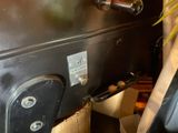 a black piece of luggage that is sitting on a table