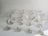 a group of wine glasses sitting on a table