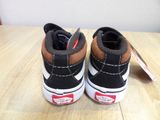 a close up of a pair of shoes on a table