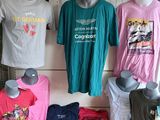a lot of t - shirts on display in a store