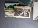 many old photos on a table with a book