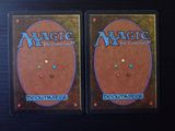 two decks of magic the gathering deck are shown on a table