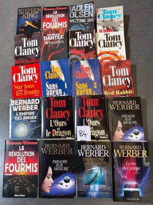 a bunch of books sitting on top of a table next to each other