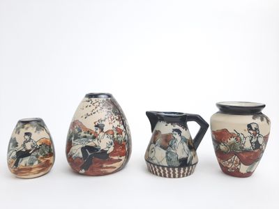 three vases with different designs on them on a white surface