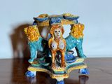 a figurine of a woman and a dog on a table