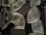 a basket full of plastic plates and pans that are sitting in it