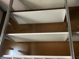 a ladder leading up to the top of a closet