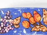 a close up of a plate with a design on it
