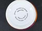 a close up of a vase with a quote on it