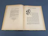 an open book with a drawing of a man holding a camera
