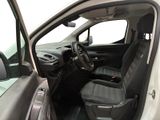 the interior of a white truck with black seats and a steering wheel