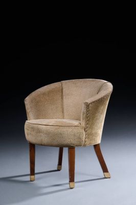 an upholstered chair with wooden legs and a beige upholstered chair with wood legs