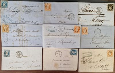 several old envelopes are sitting on top of a wooden table
