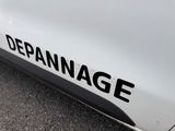 a close up of a white car with the word depannagee written on it