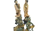 paire de figurines chinoises représentant un homme et une femme accompagnés d'une grenouille