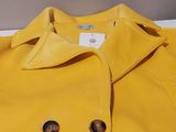 yellow peale coat with buttons and buttons on the collar
