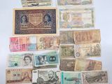 many different types of paper money on the table