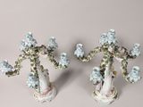 two vases that have flowers on them on a table