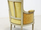 an image of a chair with yellow upholstered upholstered back