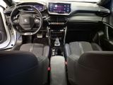 the interior of a car with a steering wheel, dashboard, and dashboard controls
