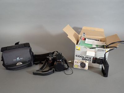 a camera, a camera case, a camera and a bag on a table