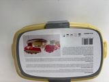 a yellow and gray lunch box with a picture on it