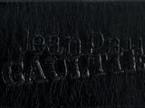 a black and white photo of a person standing in the rain