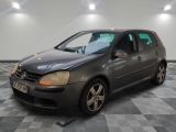 a picture of a grey car parked in a garage