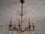 a chandelier hanging from the ceiling in a room