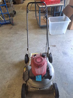 an image of a lawn mower parked in a garage