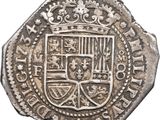 an old silver coin with a coat of arms on it