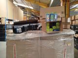 a large cart with a lot of boxes on it in a warehouse