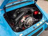a blue car with a turbo engine in it ' s trunk